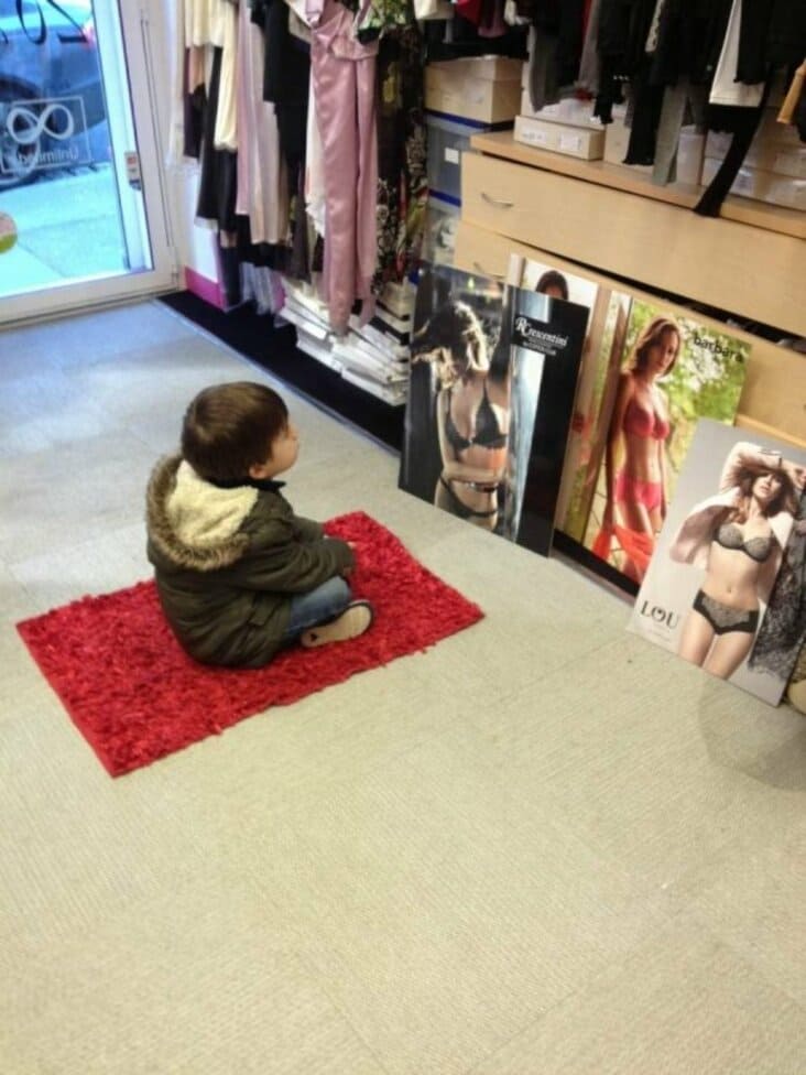 kid looking at lingerie ads, kid looking at lingerie advertisements, funny dirty picture, funny children image, funny children, funny kid picture, funny child picture