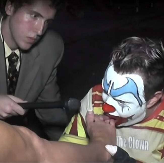 man with face paint puts womans foot in mouth, clown putting womans foot in his mouth, cursed foot image, cursed foot picture, cursed clown, cursed clown image, cursed clown picture