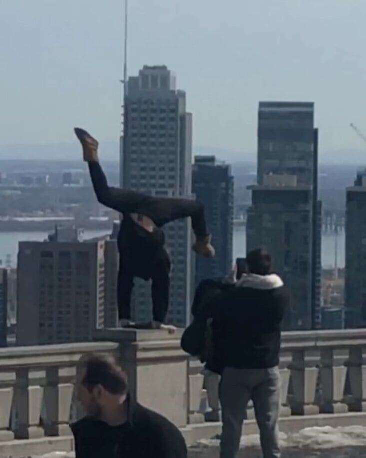 what appears to be dangerous hand stand influencer in the wild
