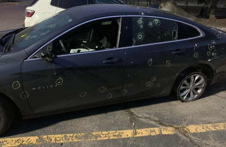 what appears to be bullet riddled car just rolled into the shop