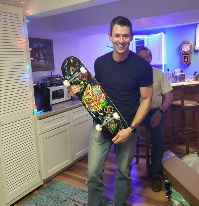 wholesome parent - man finally gets skateboard 