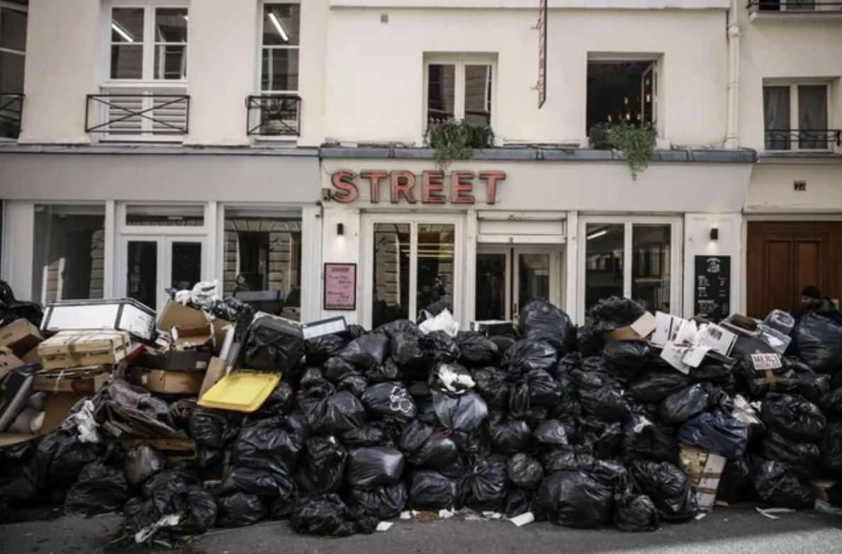 interesting posts - bin men on strike garbage piles 