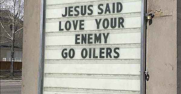 church signs funny - jesus said love your enemy go oilers