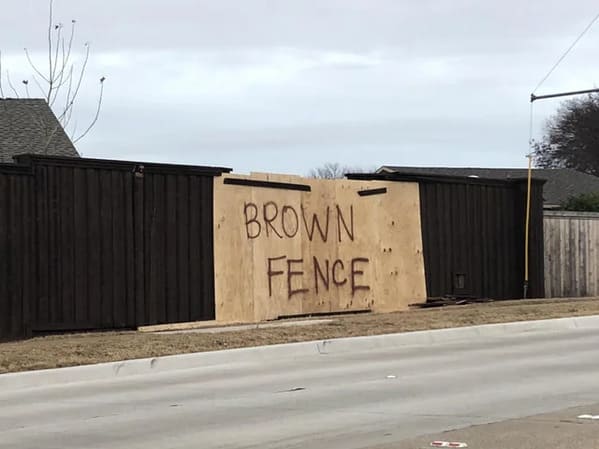 not my job - brown fence