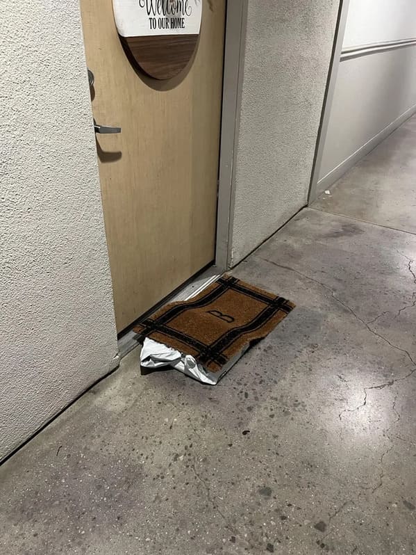 there was an attempt - to hide a package - package under doormat 