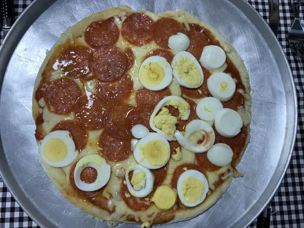 pizza crimes - hard boiled egg on pizza