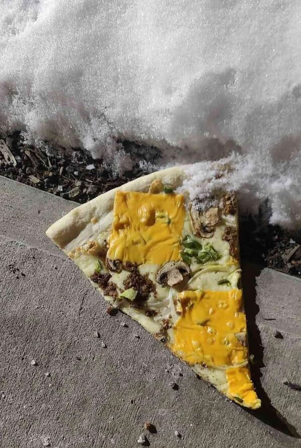 pizza crimes - a slice of pizza on the sidewalk with sliced American cheese