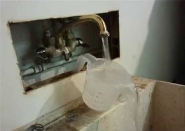 plumbing fails - sink faucet with measuring cup