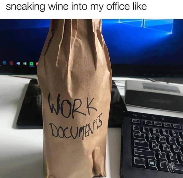 sneaking wine into my office like - paper bag with work documents written on it but clearly a bottle of wine