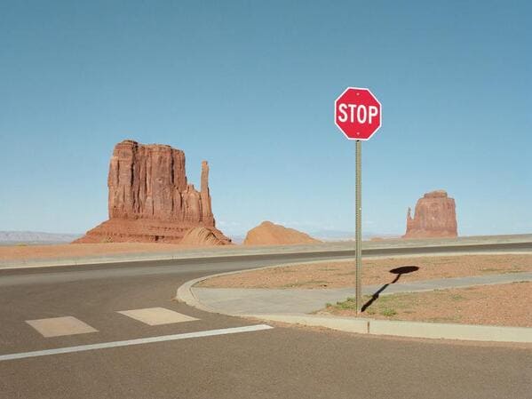 liminal space - desert valley stop sign