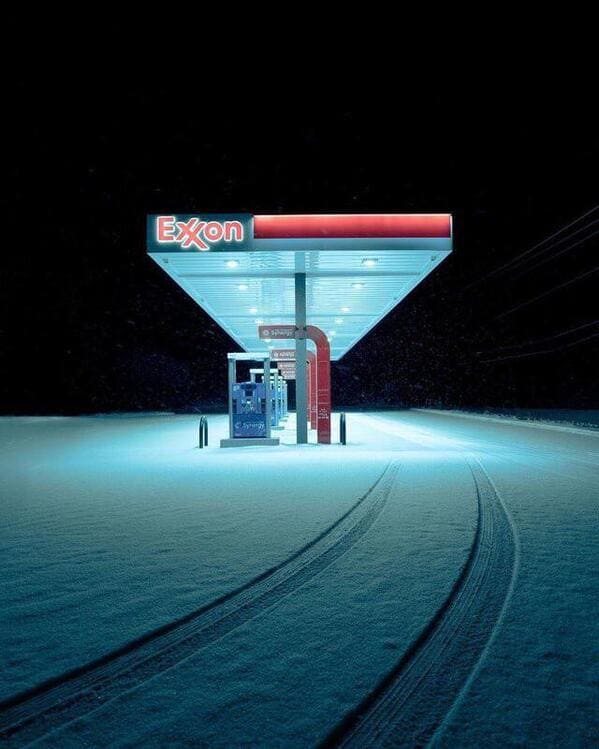 liminal space - gas station at night snow covered