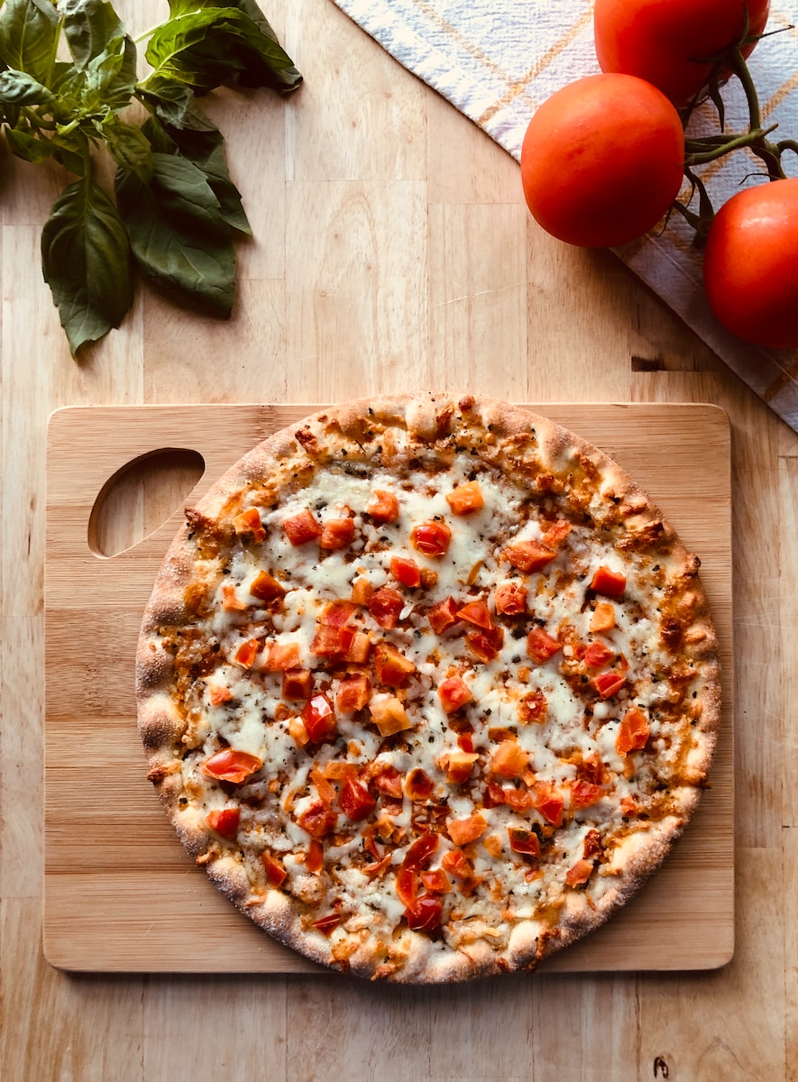 pizza on brown wooden table