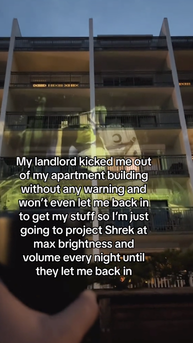 Landlord Kicks Projectionist Out Of His Apartment, So As Revenge He's Projecting Shrek On The Side Of The Building Until He Gets Back In - Jarastyle