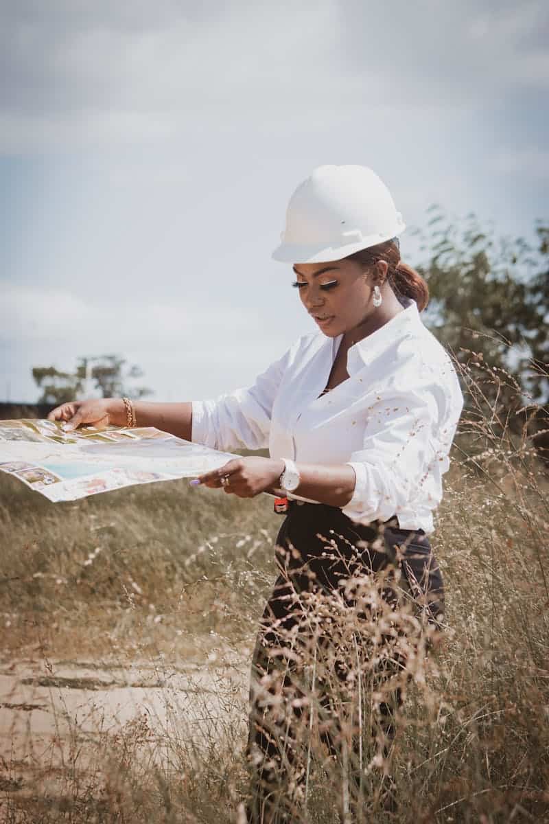 Engineer with Map in Grassfield