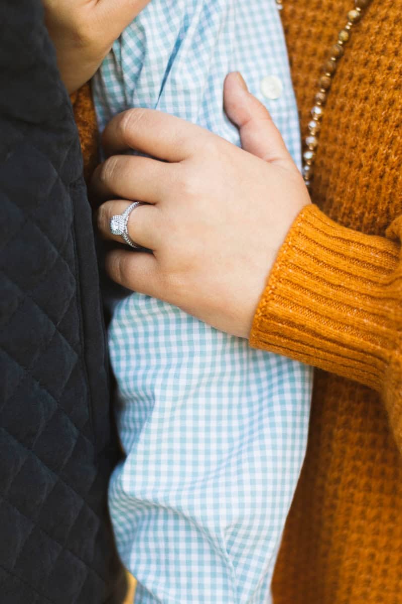 person holding another person's arm