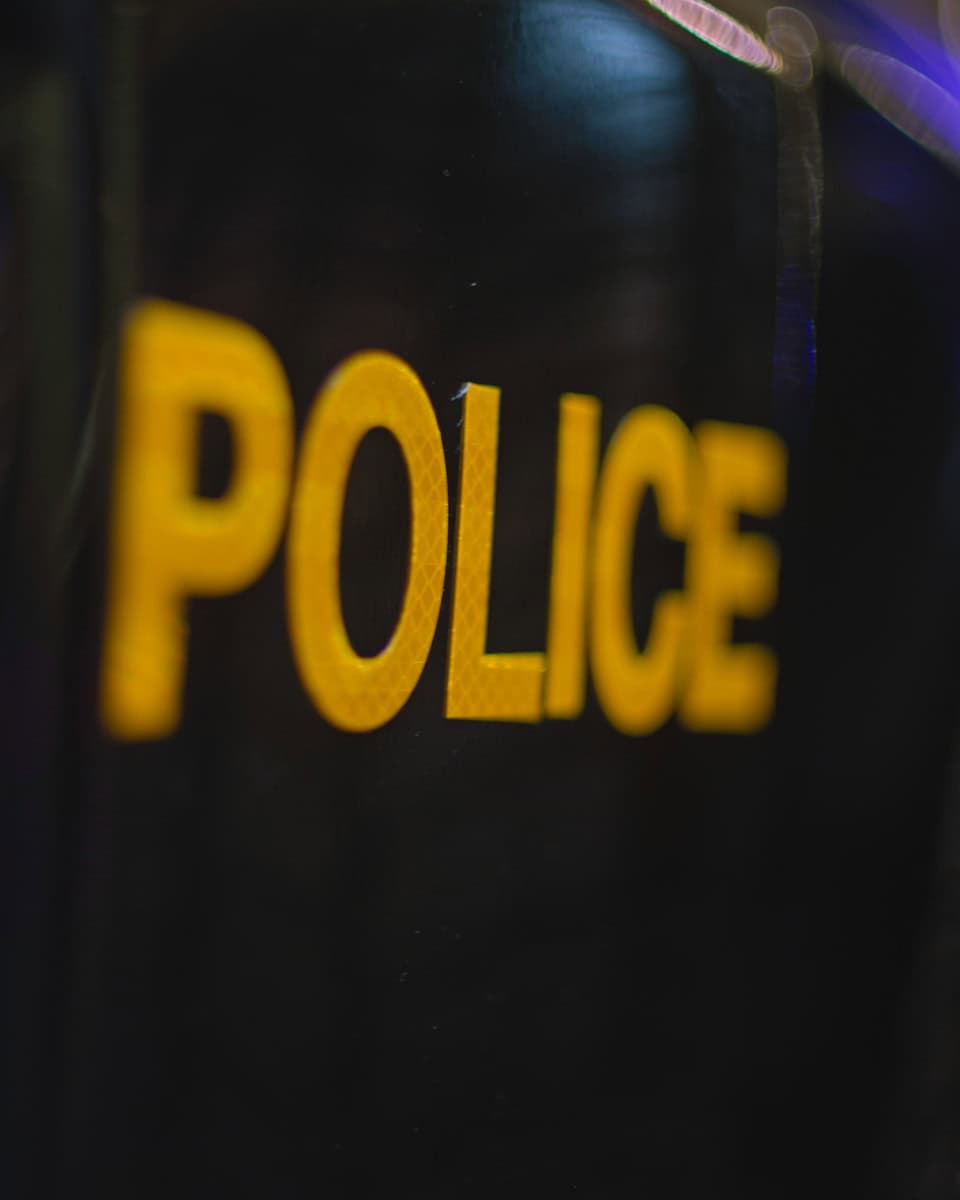 a close up of a police badge on a black background