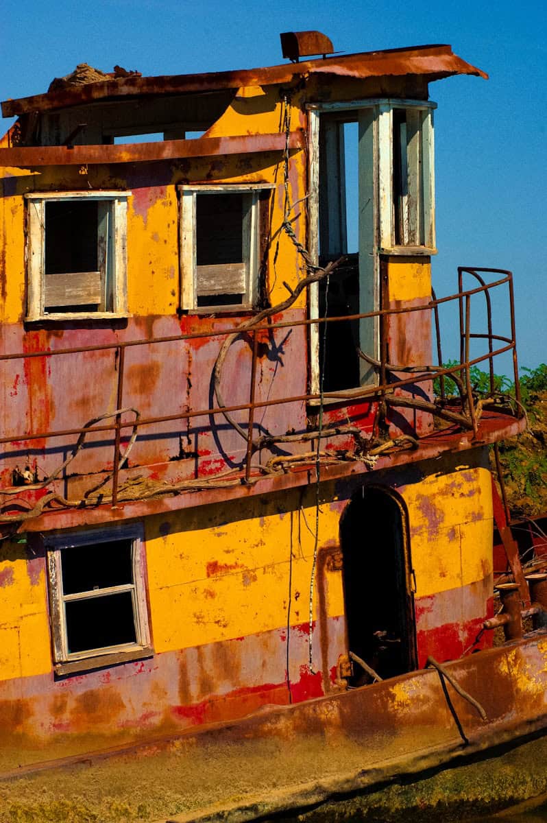 yellow and red 2-decker boat