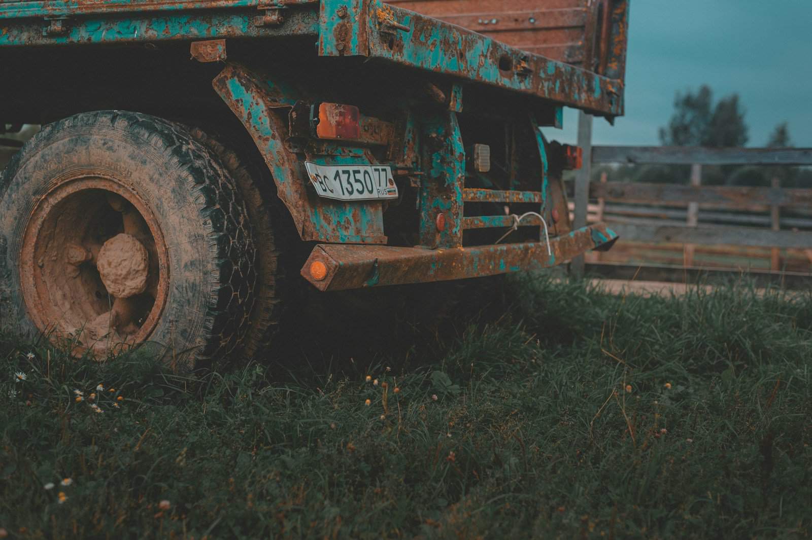 brown and black truck on brown field during daytime