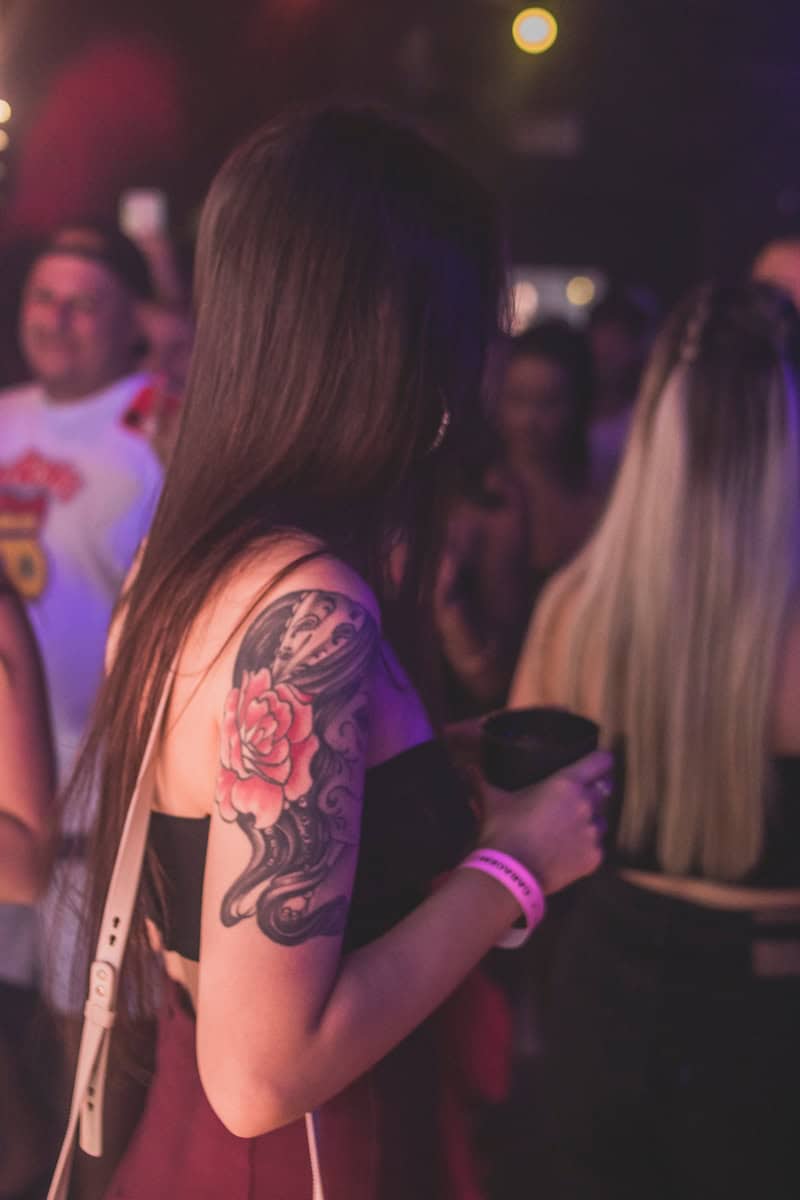 a woman with a tattoo on her arm