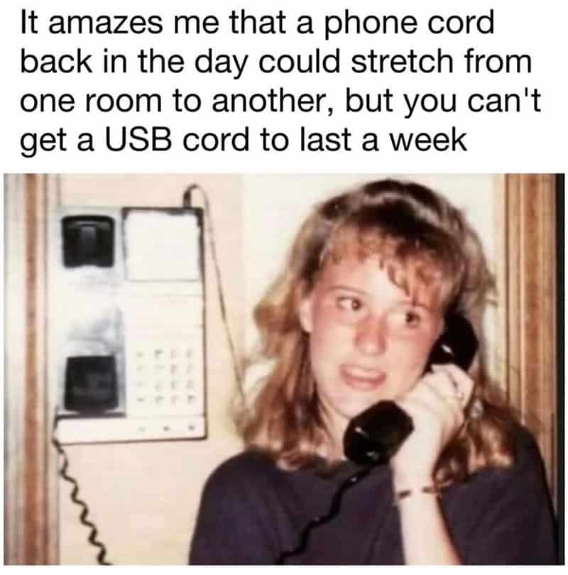 Nostalgic photo of a woman using a landline phone with a long cord. Reflects the era before USB cord.