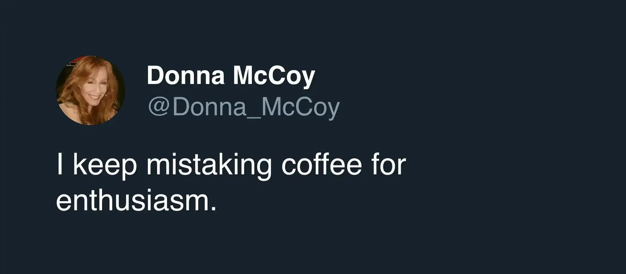 Woman holding a large coffee mug with a humorous expression, emphasizing coffee obsession.