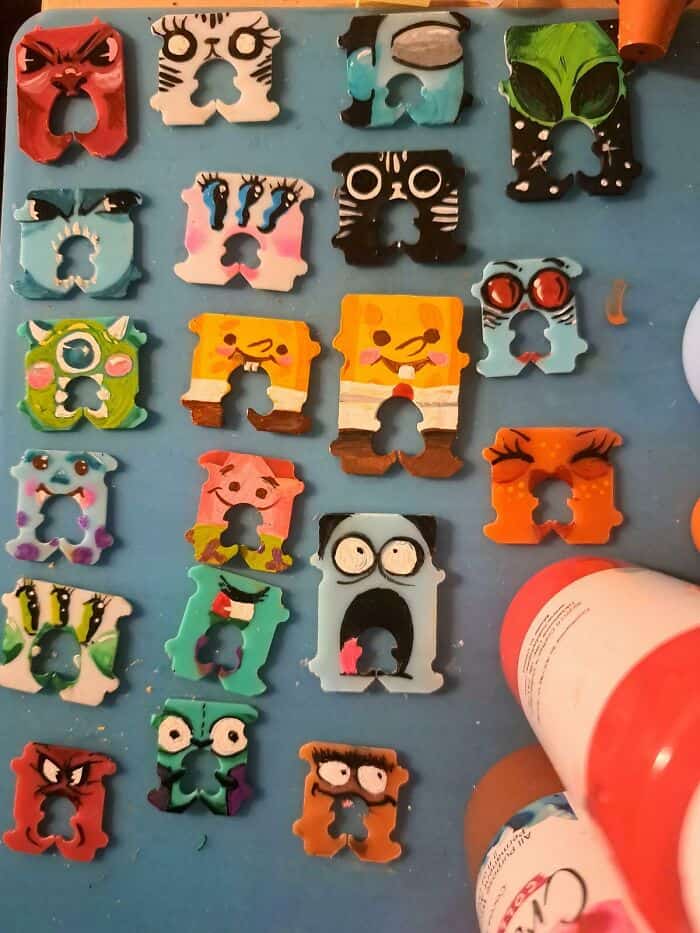 Vibrant animal face paper cutouts featuring various designs, perfect for arts and crafts, decoration.
