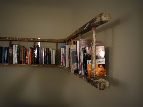 Bookshelf with books on rustic wooden shelf, wall-mounted display for reading and decor.