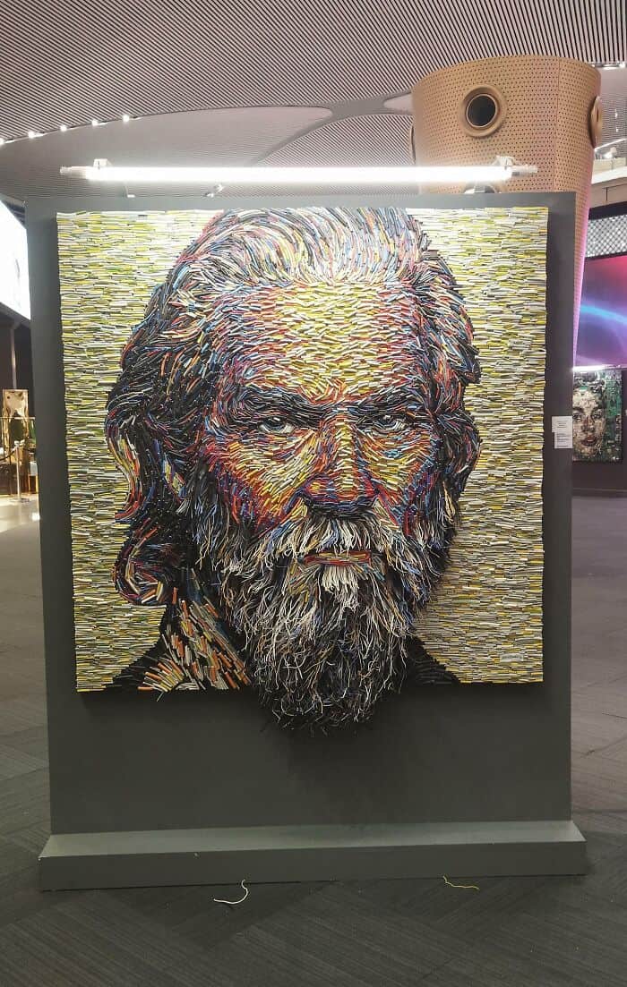Portrait of a bearded man created with vibrant, textured mosaic-style art.