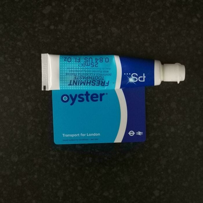 Travel-sized Oyster toothpaste tube for oral hygiene and freshness.