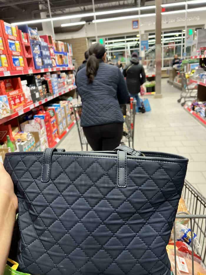 Shopping at Pleated Jeans store with a focus on trendy bags and accessories.