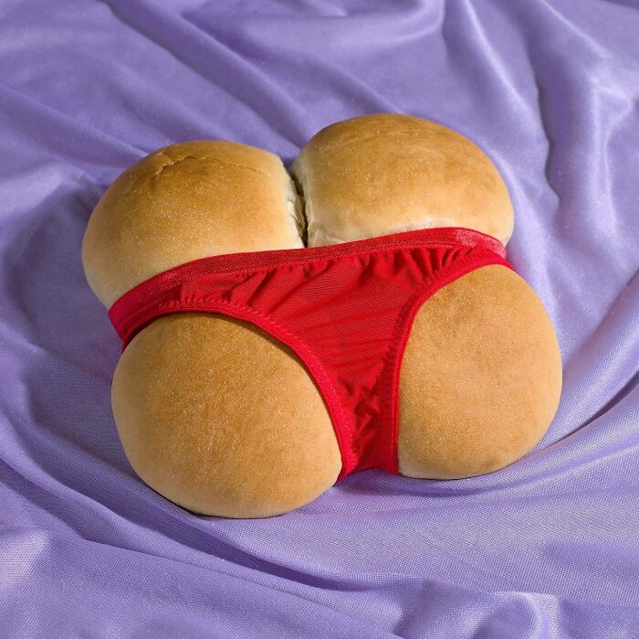 Bread rolls with a red underwear, blending humor and surrealism in food art.