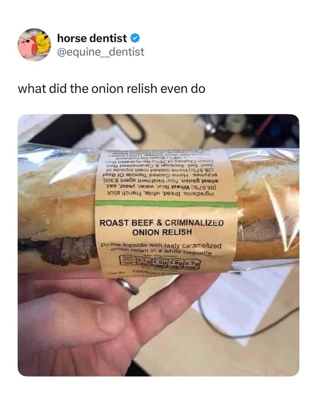 Roast beef and criminalized onion relish in a white baguette sandwich.