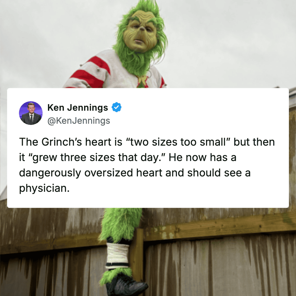 The Grinch wearing a Santa costume with a mischievous expression.