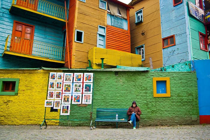 Vibrant, colorful city buildings with bright facades and unique architecture, showcasing a lively ur.
