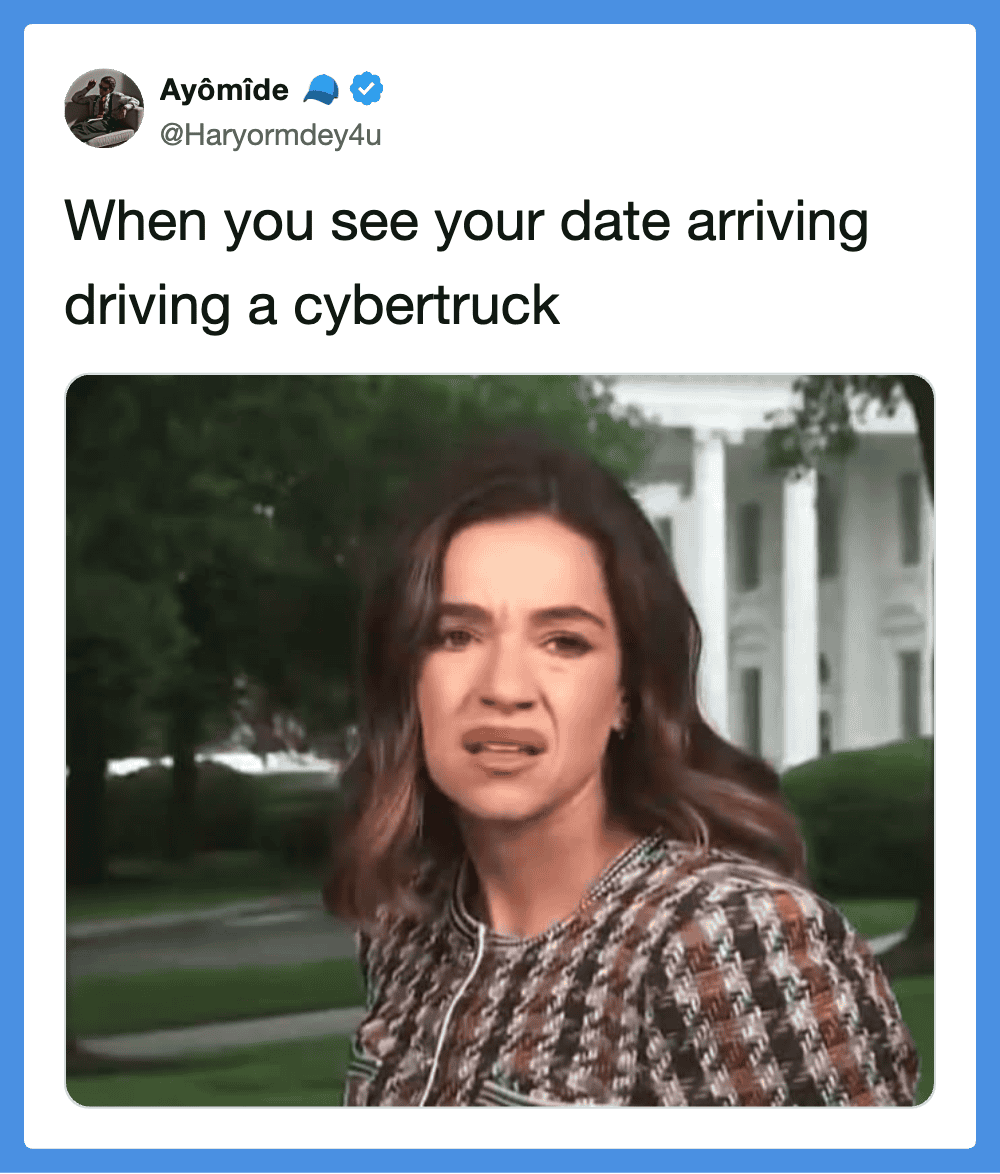 Woman with confused expression witnessing a cybertruck arriving.