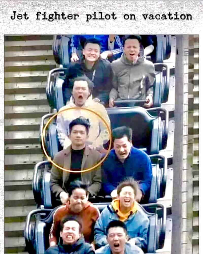 A group of friends enjoying a roller coaster ride, with one person circled, humorously resembling a.