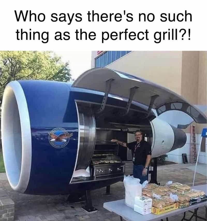 Humorous airplane-themed grill setup with a chef inside a plane fuselage.