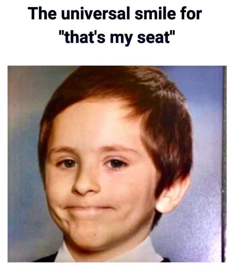 Child with a universal smile, "that's my seat" meme, aviation humor.