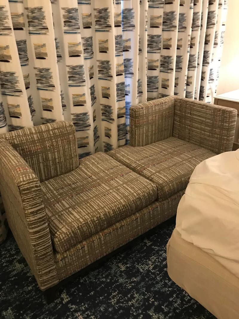 Comfortable plaid-patterned sofa in a cozy living room setting.