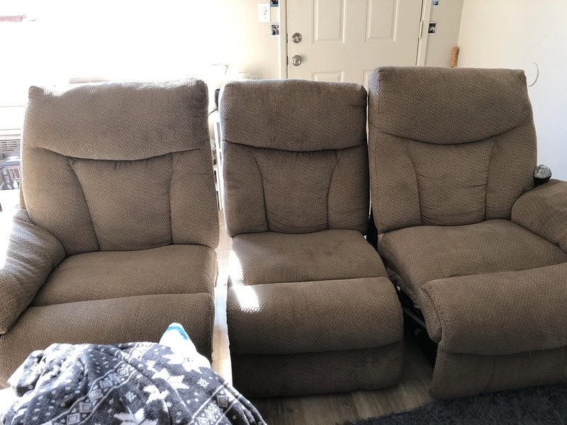 Recliner chairs in a cozy living room, featuring plush fabric and ergonomic design for relaxation.