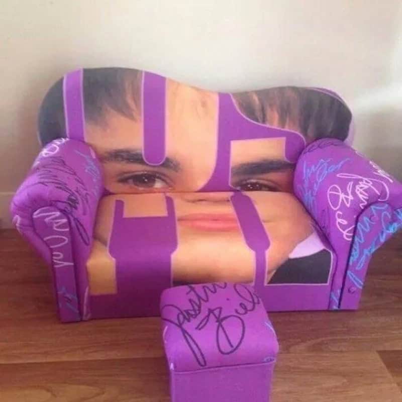 Custom face print sofa with signature details, vibrant purple color, and playful design for fun home.