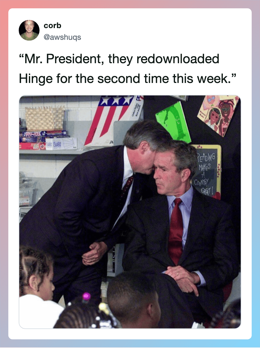 Two men in suits, one whispering to the other, in a classroom setting.