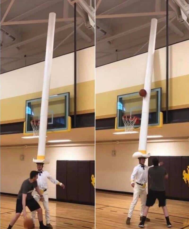 Hilarious basketball shot involving a tall pole and a ball, creating a funny and unexpected moment d.