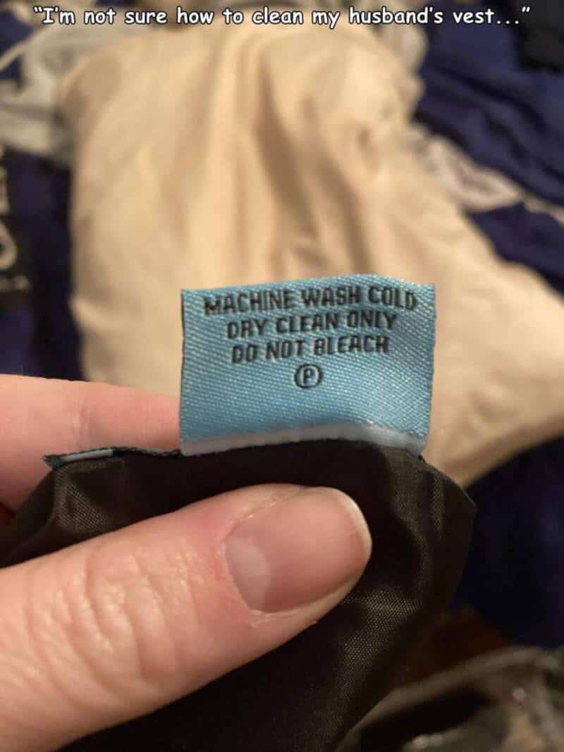 Laundry care label on husband's vest showing cold wash instructions.