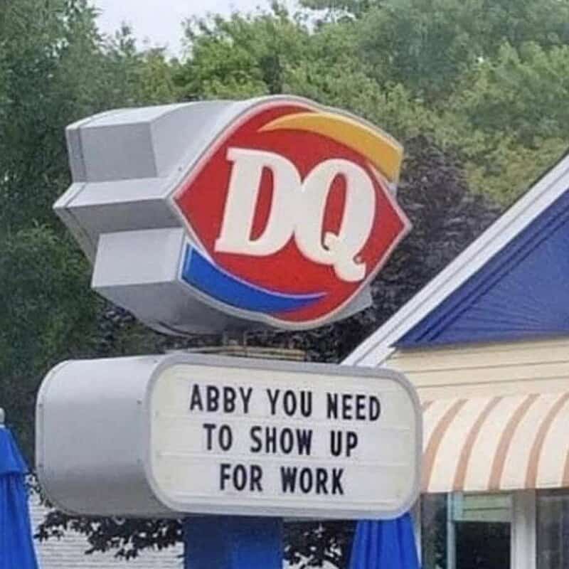 Dairy Queen sign with humorous message about showing up for work.