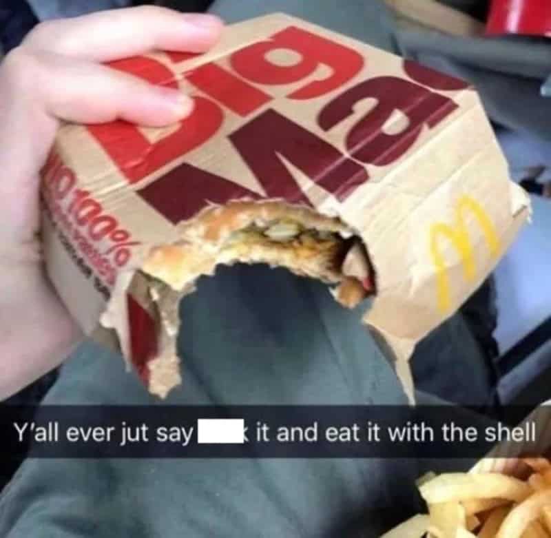 Humorous picture of a McDonald's burger with a large bite missing, showing the messy interior.