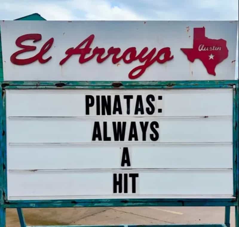 Signboard at El Arroyo restaurant in Austin with funny message about pinatas.