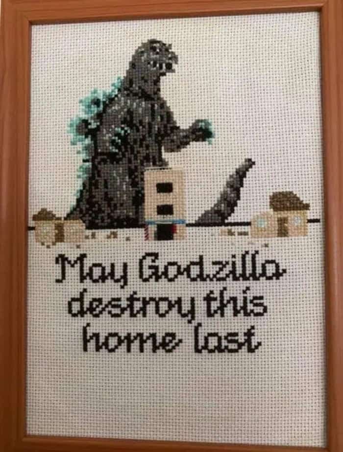 Godzilla destroying a house with the text "May Godzilla destroy this home lost" written below.
