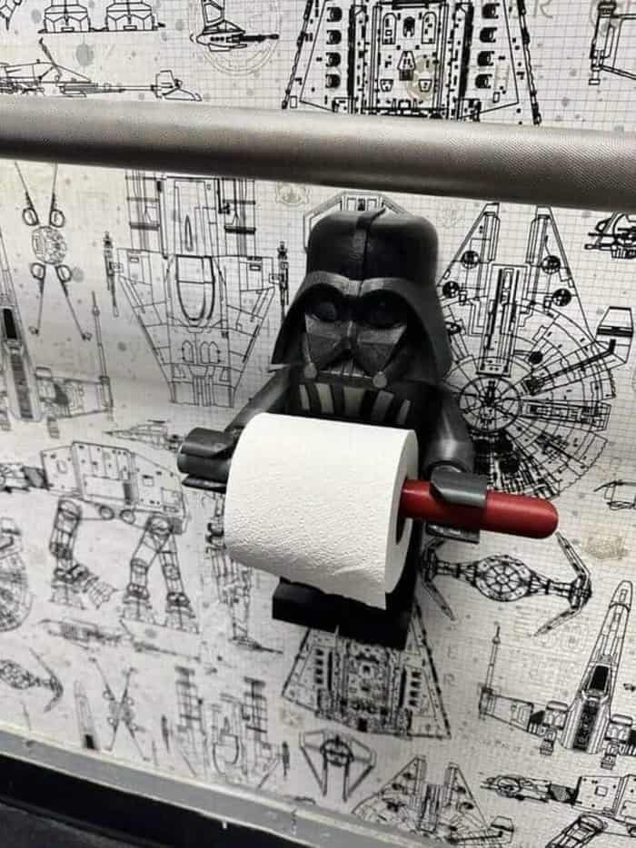 Darth Vader toilet paper holder on a blueprint background.