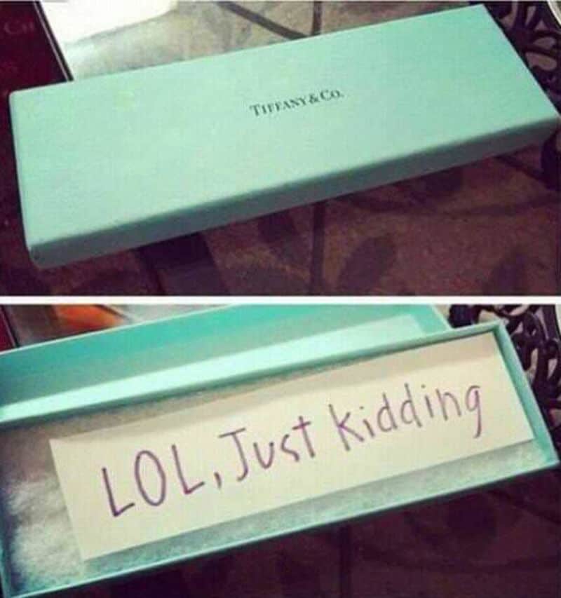 Tiffany & Co. jewelry box with humorous "LOL, Just kidding" note inside.